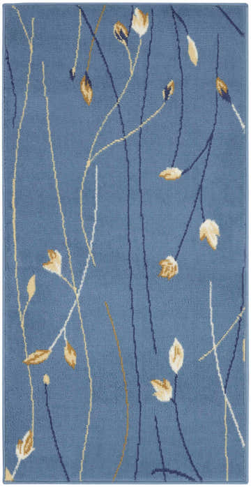 Close-up of the Nourison Grafix Light Blue rug. Features a contemporary floral design with light blue, gold and navy accents.