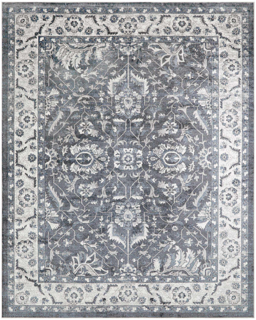 Close-up of the slate blue Nourison Astra Rug. Vintage floral design with taupe accents. Machine-made texture.