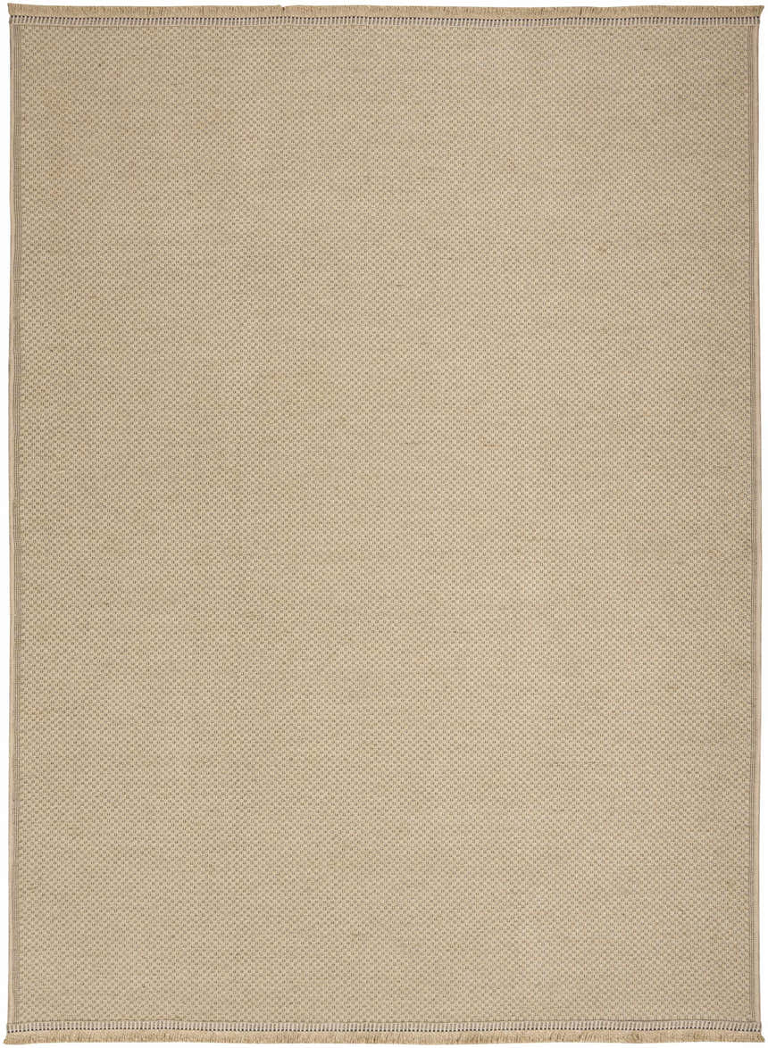 Close-up of the Nourison Jute Natural rug. The brick red jute rug features a subtle, modern woven texture.