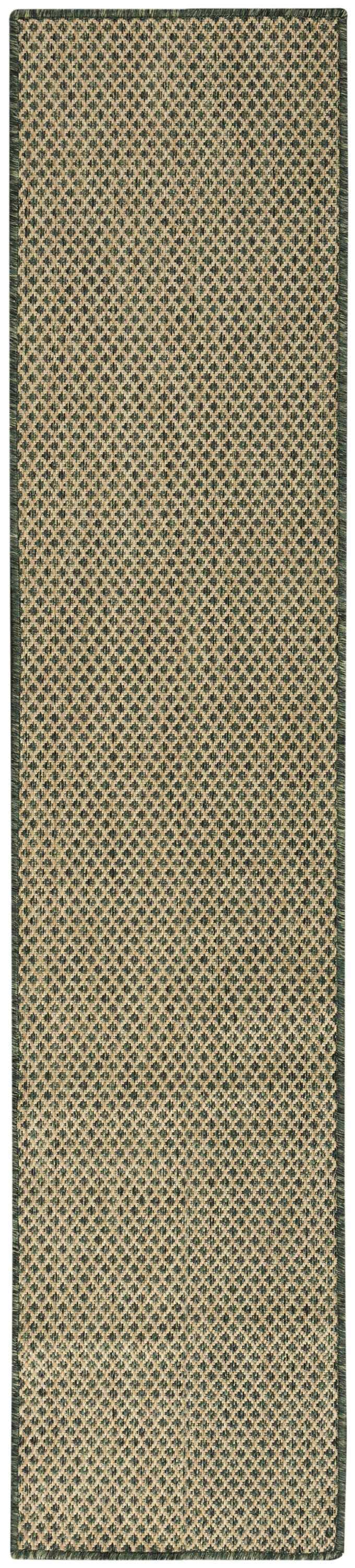 Close-up of the green Nourison Courtyard rug runner, featuring a woven diamond pattern and textured polypropylene material.