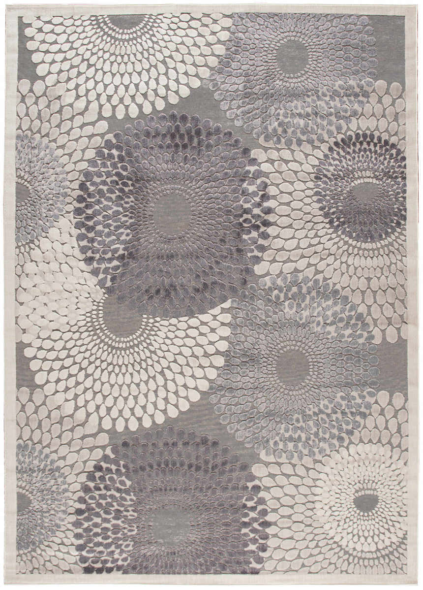 Close-up of the Nourison Graphic Illusions grey rug. Features a modern floral burst pattern in shades of gray and white.