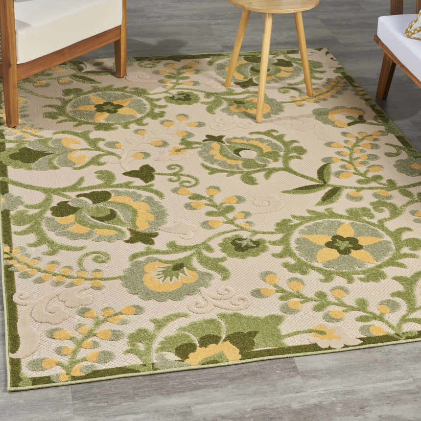 Styled room featuring Nourison Aloha Ivory Green Outdoor Area Rug with floral chestnut pattern.