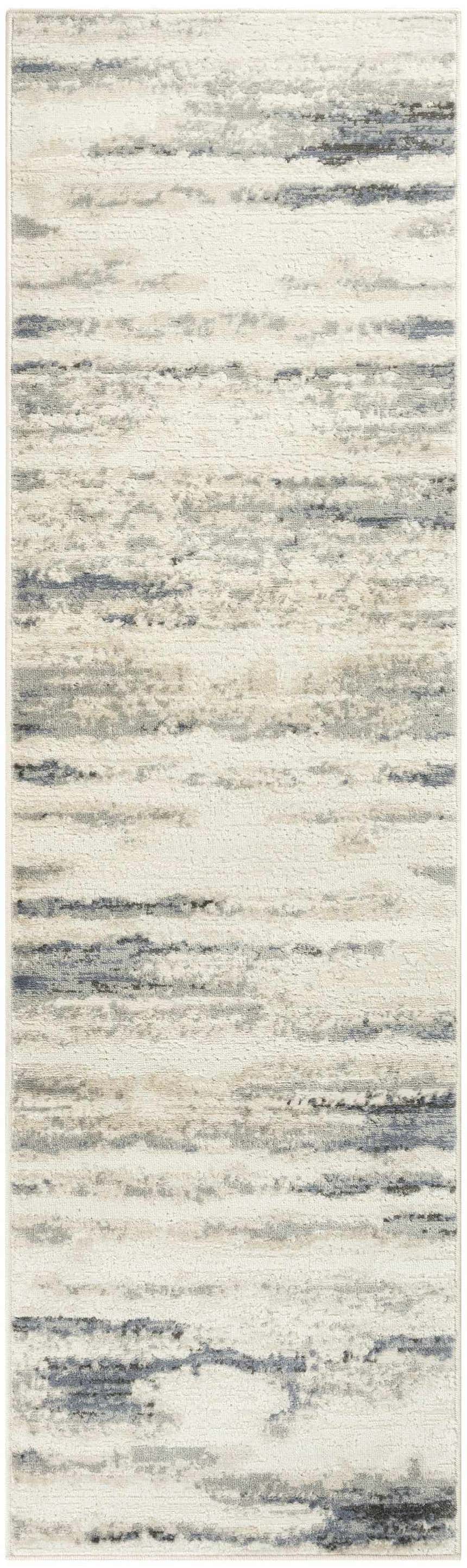 Close up of Nourison Serenity Home Blue Multicolor rug. High pile, machine made with blue, gray and cream horizontal stripes.