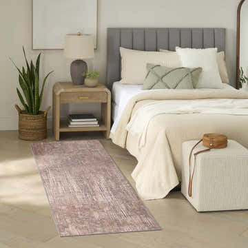 Bedroom scene with Nourison Botanical s Taupe runner rug, wood floors, neutral bedding, and mid-century modern decor.
