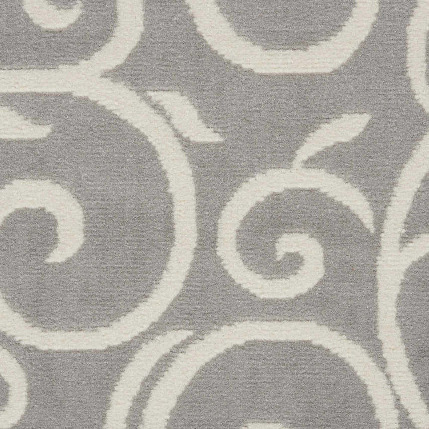 Close-up of the Nourison Grafix Grey rug showing the contemporary swirl pattern and soft, textured polypropylene.