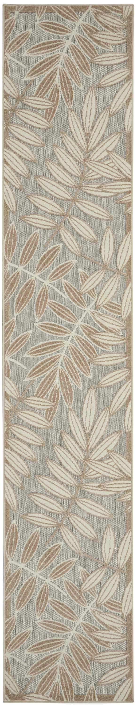 Close-up of Nourison Aloha Natural Tropical Area Rug. Beige and brown leaves on a textured gray background.
