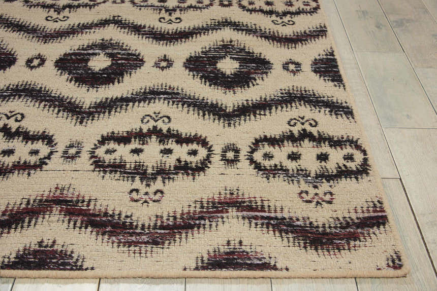 Close-up of Nourison Spectrum Beige Black Indoor Area Rug with tribal-inspired pattern and textured wool blend.