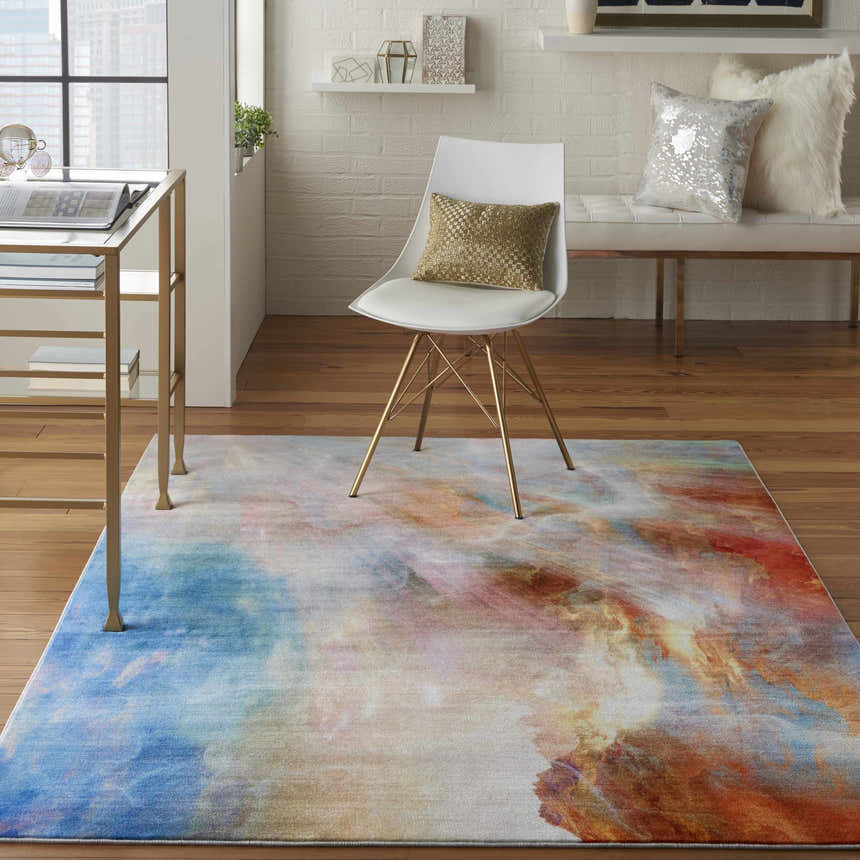 Modern office with a Nourison Le Reve Multicolor rug, gold desk, and white chair.