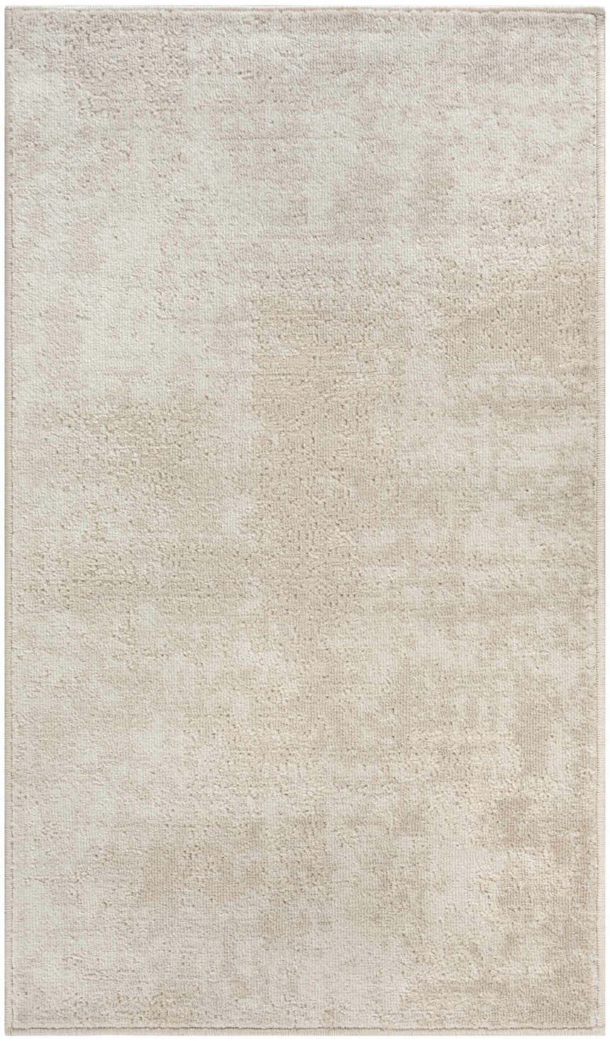 Close-up of the high-pile Nourison Serenity Home Ivory Area Rug, showing texture and subtle chestnut color variations.