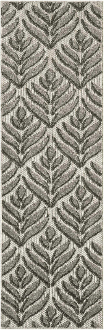 Close-up of the Nourison Aloha Charcoal Outdoor Area Rug, featuring a taupe leaf pattern on a textured background.