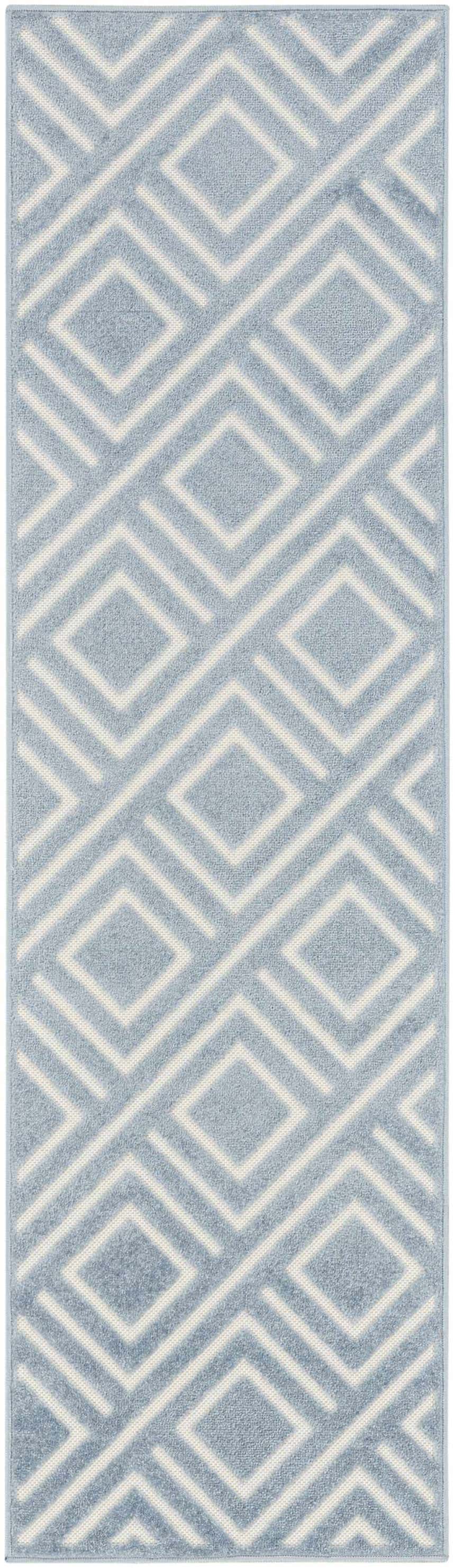 Close-up of the Nourison Care Free Blue rug featuring a geometric diamond pattern.