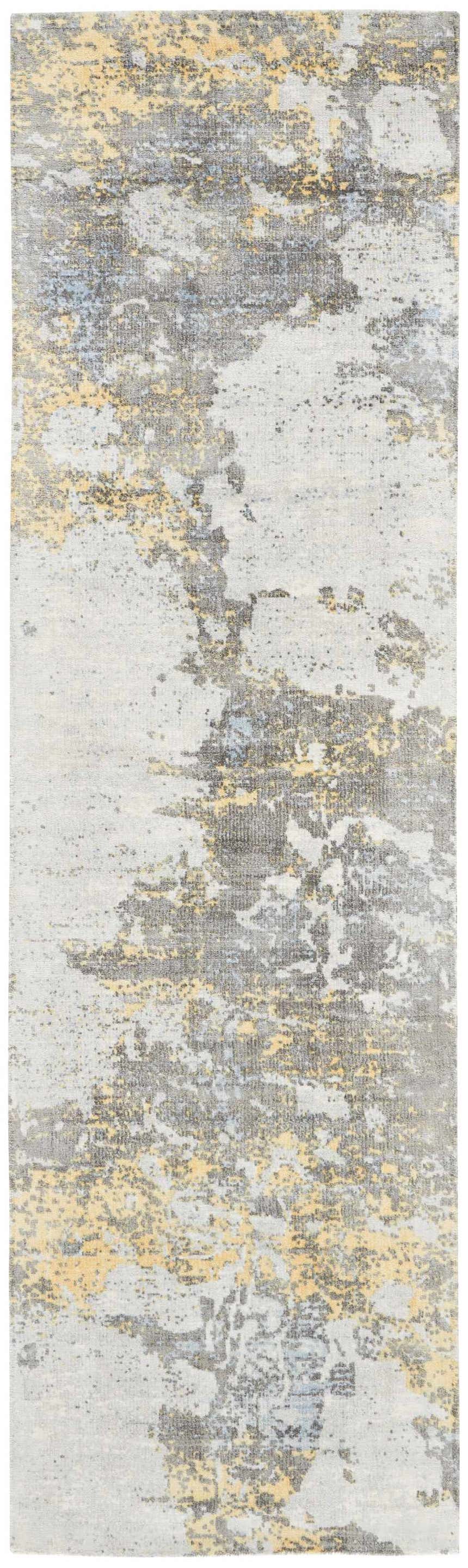 Close-up of Nourison Safari Dreams Ivory Gold Painterly rug. Abstract chestnut, gray, and gold design.
