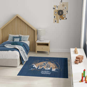 Kids bedroom scene with Nourison Imagination Blue Area Rug featuring a cyclist design.