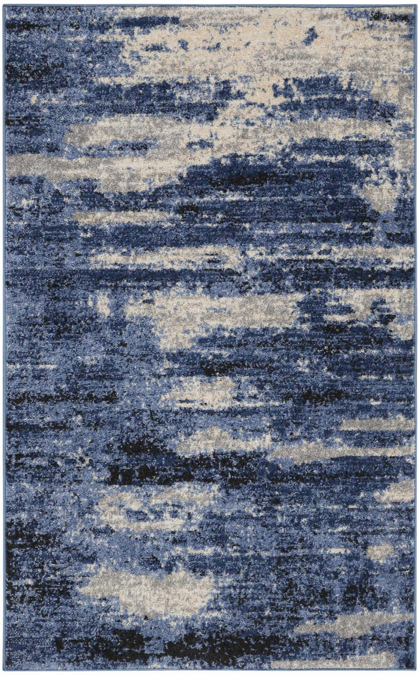 Close-up of Calvin Klein River Flow Blue Grey rug, featuring a modern abstract pattern and soft, plush texture.
