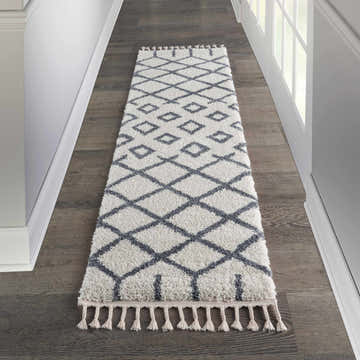 Hallway scene with a Nourison Moroccan Shag runner rug in off-white with a gray tribal diamond pattern and tassels.