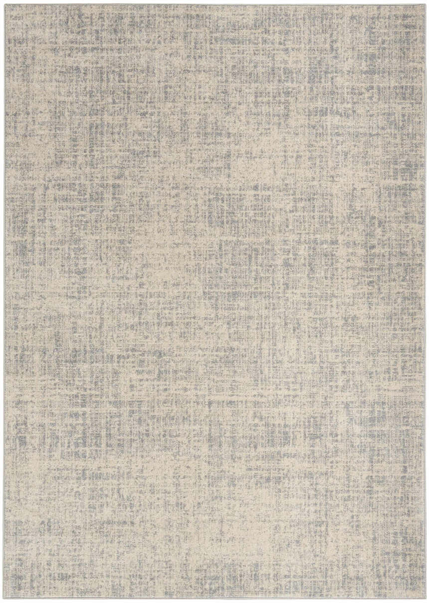 Close-up of the Calvin Klein CK030 Currents rug. Beige and gray modern design with a subtle, textured pattern.