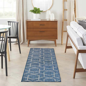 Mid-century modern dining room with Nourison Horizon Denim Area Rug runner.