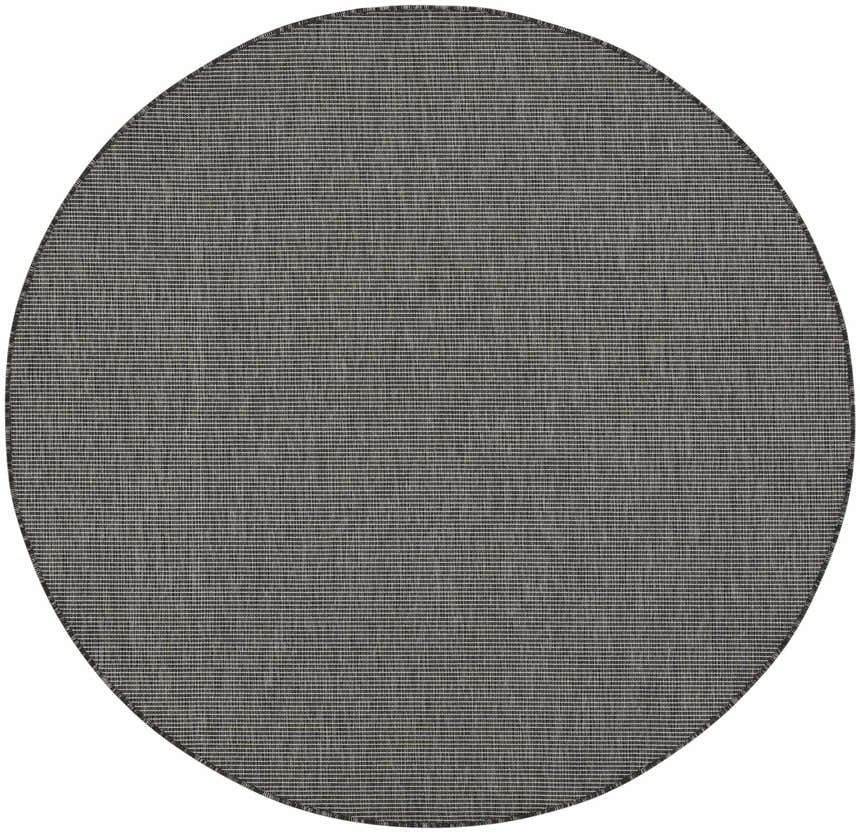 Close-up of round Nourison Positano Charcoal rug. Taupe color with a subtle, textured, mid-century modern design.