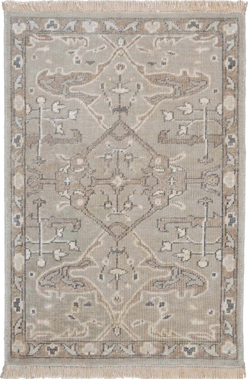 Close-up of a silver gray Nourison Aldora Vintage Indoor Area Rug with a subtle, ornate pattern and fringed edges.