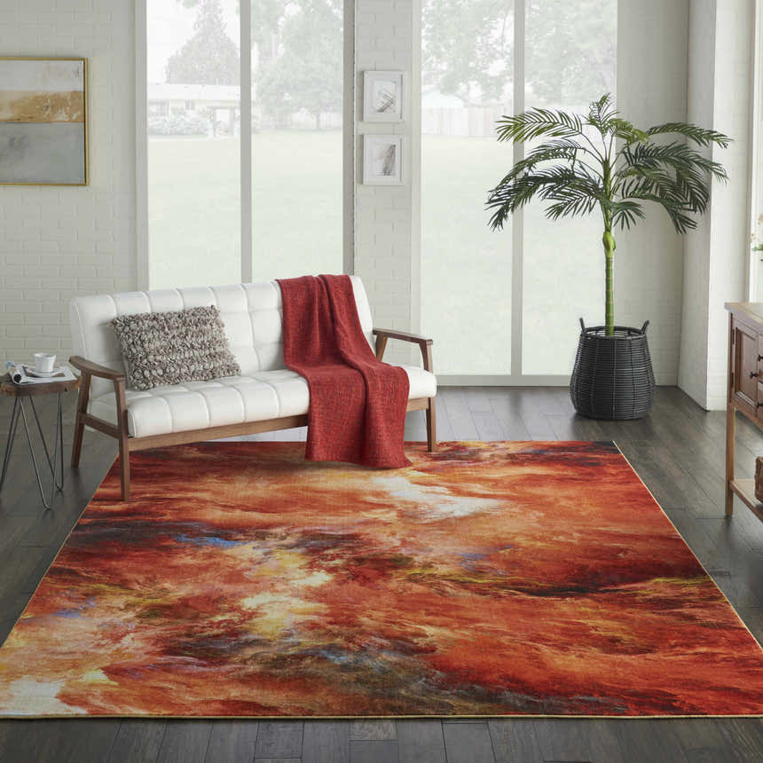 Bright living room with white sofa and Nourison Le Reve Red Flame rug, a modern accent with a fiery abstract design.