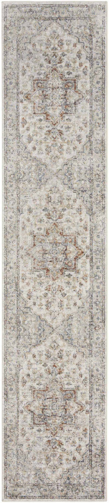 Close-up of the Nourison Astra Grey Multicolor Vintage Washable Area Rug. Floral design in gray, brown, and blue hues.