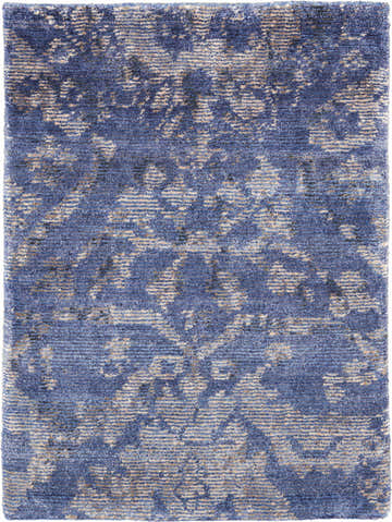 Close-up of the Nourison Lucent Dusk Vintage Area Rug. Blue and beige silk-like fiber with a distressed, handmade vintage pattern.