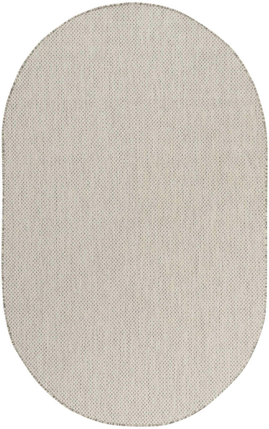 Close-up of oval Nourison Courtyard Ivory Silver rug. Neutral woven texture with subtle silver accents.