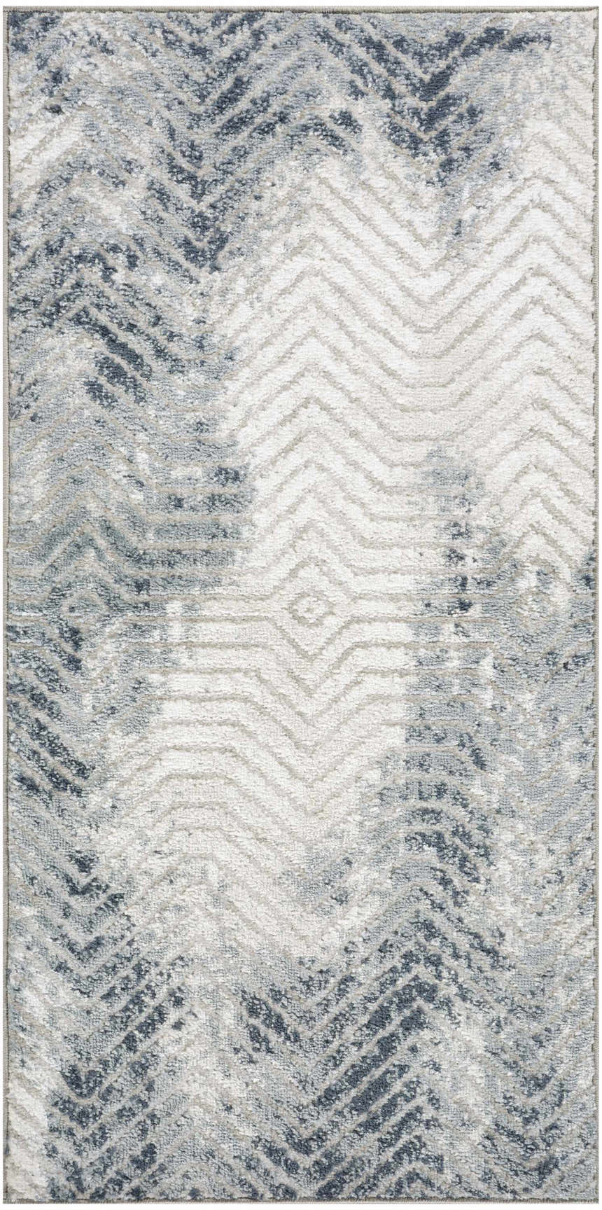 Close-up of the Nourison Dekor Grey Navy rug featuring a modern chevron pattern and high pile texture.