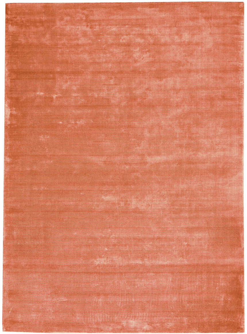 Close-up of the Calvin Klein Home Lunar Rust rug, showing its subtle horizontal striations and soft, textured weave.