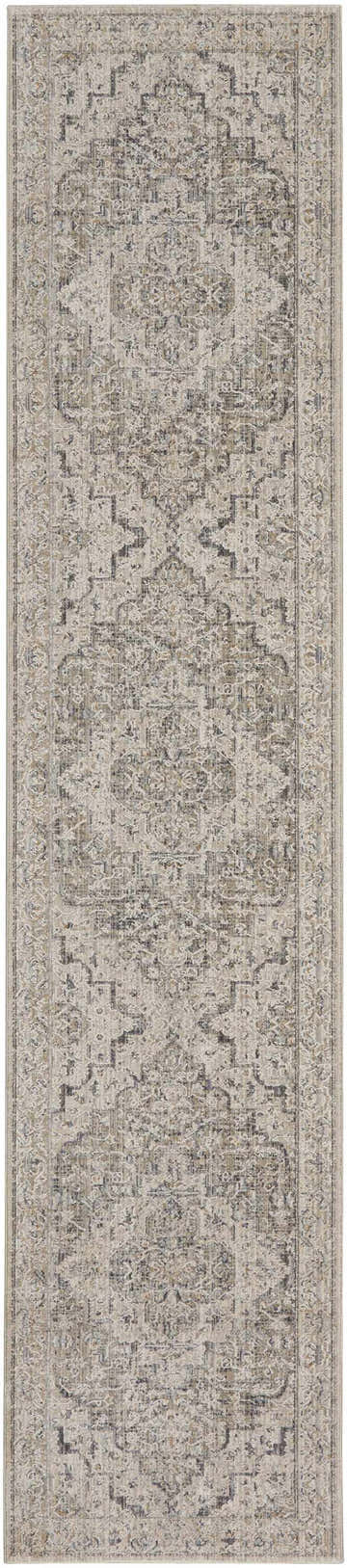 Close-up of a Nourison Lynx Ivory Taupe Vintage Indoor Area Rug featuring a distressed, ornate pattern in ivory, taupe, and gray tones.