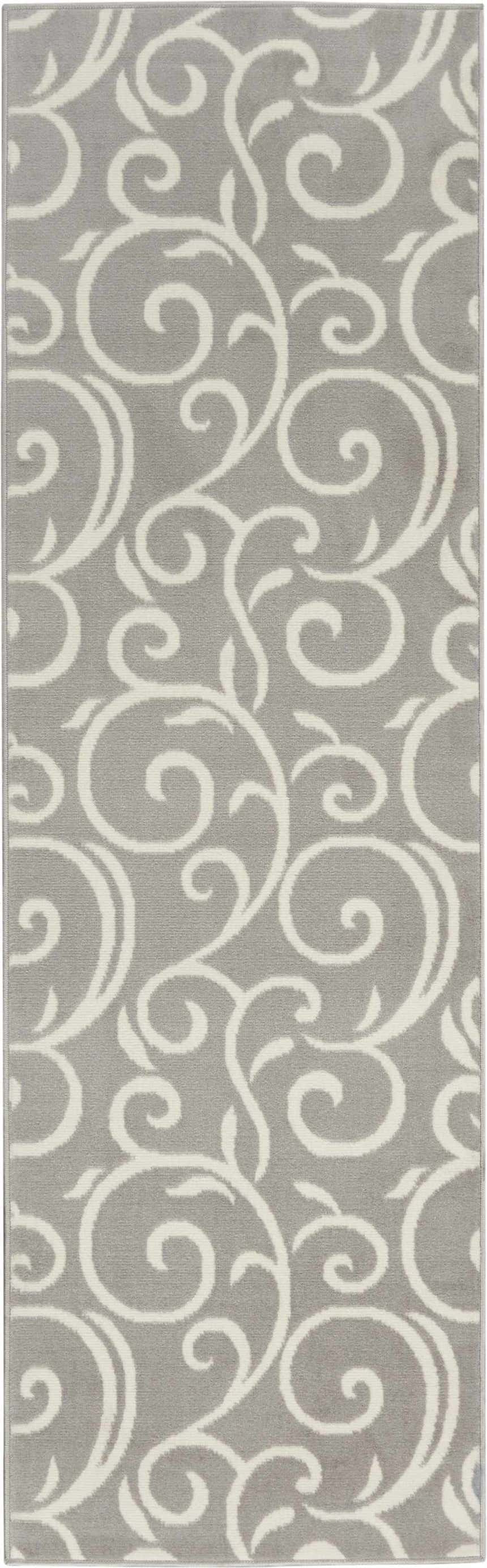 Close up of the Nourison Grafix Grey area rug, featuring a swirling, contemporary pattern.
