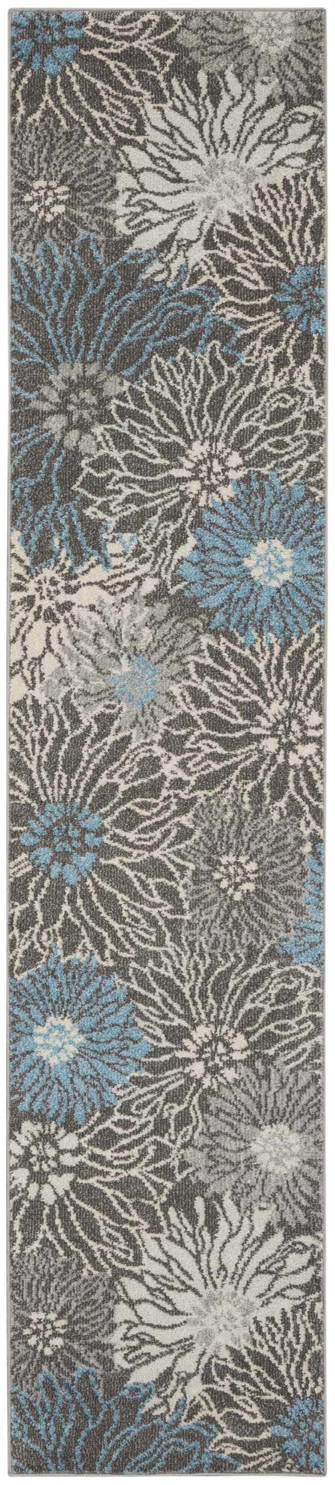 Close-up of Nourison Passion Charcoal Blue rug. Floral pattern in charcoal, taupe, and blue hues. Contemporary style.