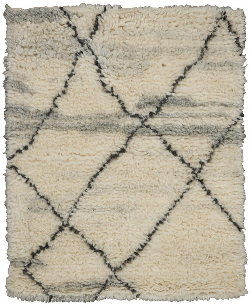Close-up of the Calvin Klein San Antonio rug. Ivory shag rug with a chestnut Moroccan diamond pattern. Handmade wool texture.