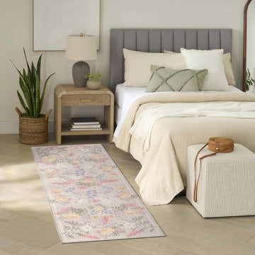 Farmhouse bedroom with Nourison Botanical Beige Multicolor runner rug, wood floors, neutral bedding, and woven accents.