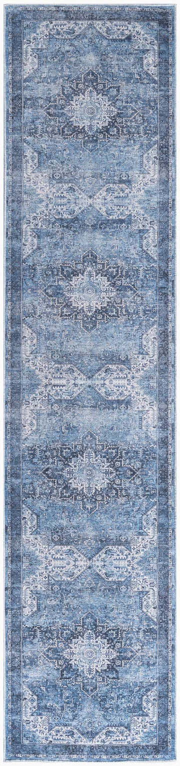 Close-up of the Nourison Blue Vintage Indoor Washable Area Rug, featuring a distressed light blue vintage pattern.