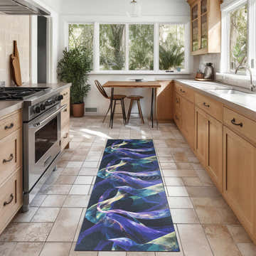 Bright kitchen with Nourison Blue Multicolor washable rug, wood cabinets, tile floor, and breakfast nook.