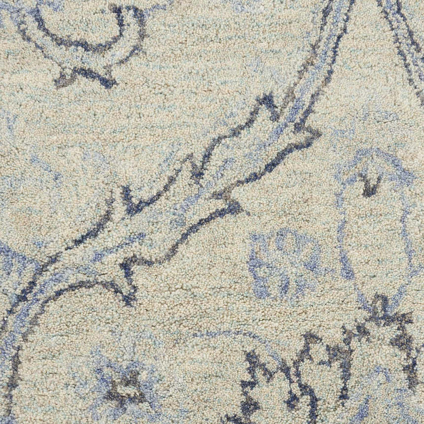 Close-up of the Nourison Jazmine Ivory/Blue Persian rug showing wool texture and floral pattern.