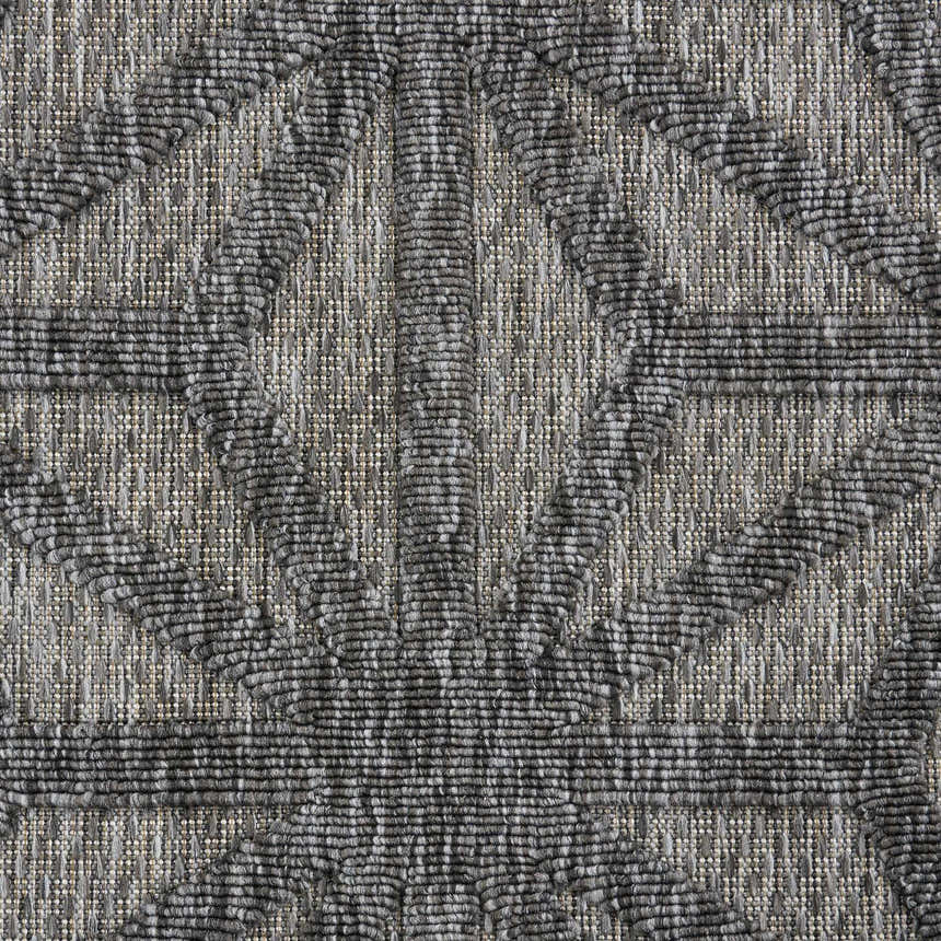 Close-up of the textured, geometric pattern on the Nourison Cozumel Dark Grey Modern Area Rug.