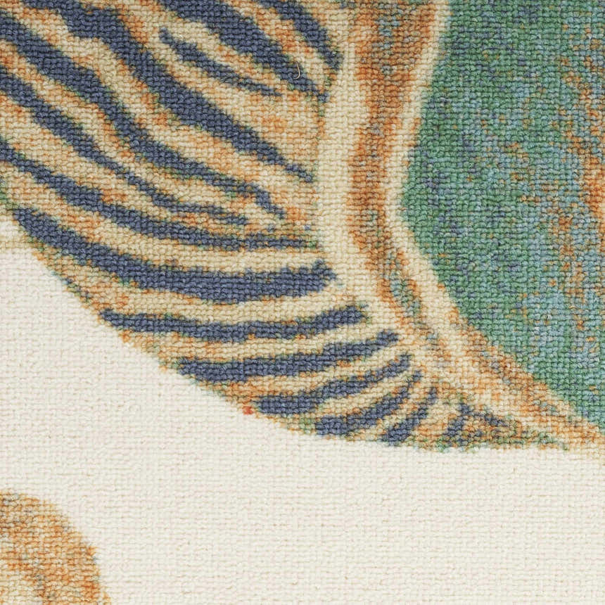 Close-up of Waverly Sun N' Shade Ivory Multicolor rug, featuring a coastal-inspired pattern with blue, green, and chestnut hues.