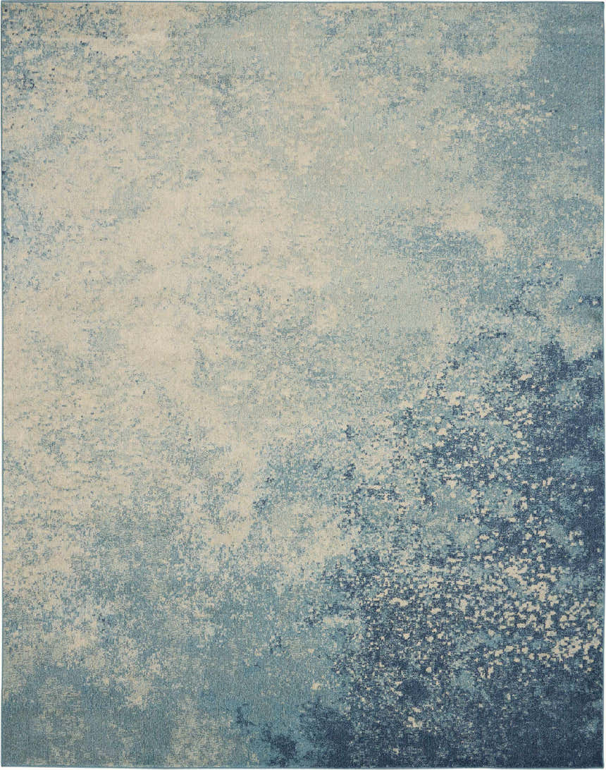 Close-up of the Nourison Passion Navy Light Blue rug, showing its abstract, watercolor-like pattern and texture.