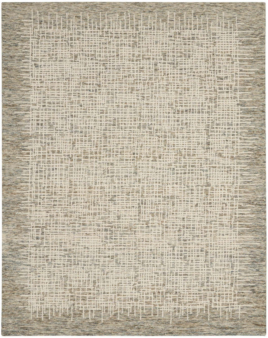 Close-up of Nourison Colorado Ivory Multicolor rug. Southwestern style with a textured, grid-like pattern in ivory, chestnut, and brown.
