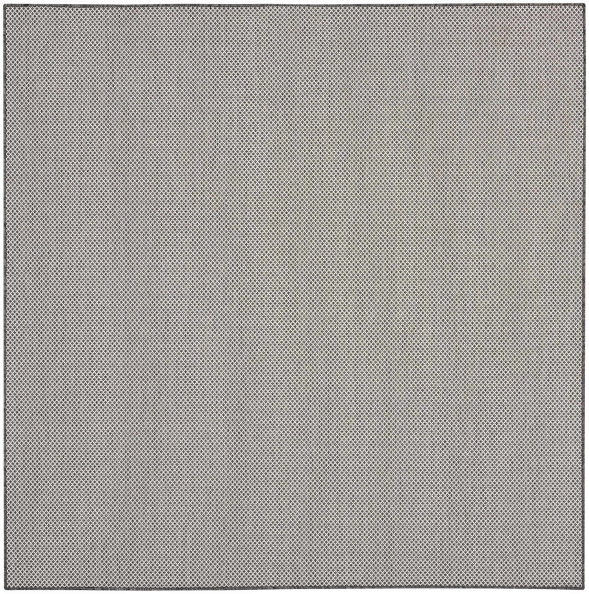 Close-up of the Nourison Courtyard Ivory Charcoal rug, featuring a small-scale diamond pattern.