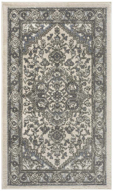 Close-up of Nourison Quarry Ivory Blue Vintage rug, showing chestnut floral pattern and high pile texture.