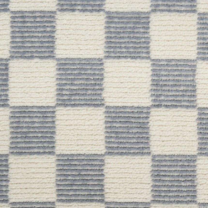 Close-up of Nourison Serenity Home Ivory Blue Rug. High pile rug with a modern checkered pattern and textured design.