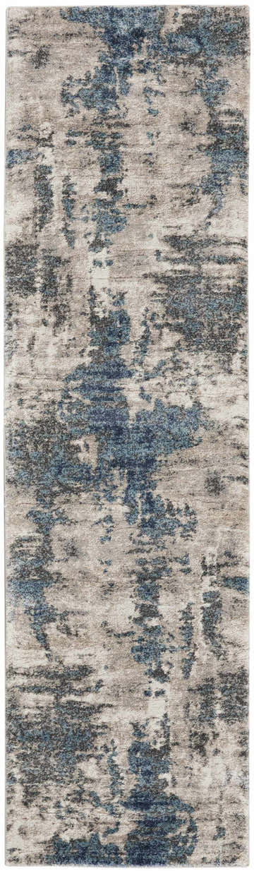 Close-up of Nourison American Manor rug in ivory and blue. Modern abstract design with chestnut accents.