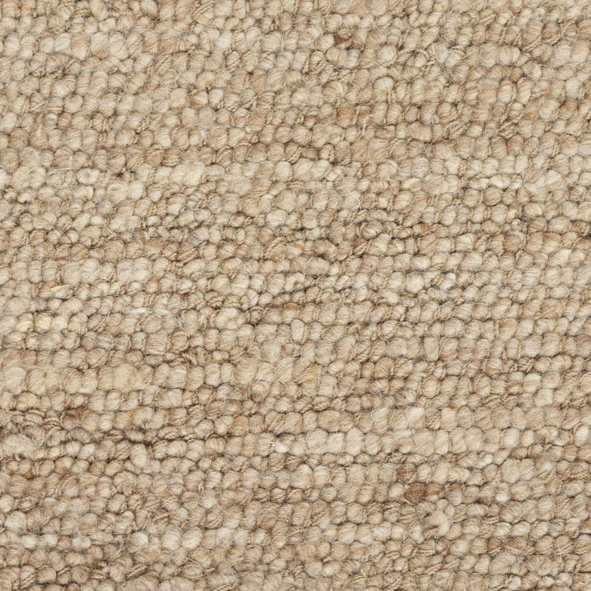 Close-up of the handmade Nourison Alanna Beige rug showing its looped wool texture and neutral color.