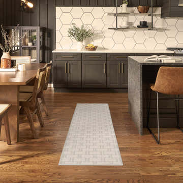 Scandinavian kitchen with Nourison Nordic Ivory Grey runner rug, wood floors, and dark cabinets.