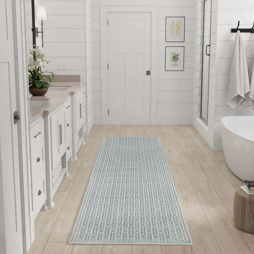 Modern farmhouse bathroom with Nourison Charm Blue Ivory runner rug on wood floor.