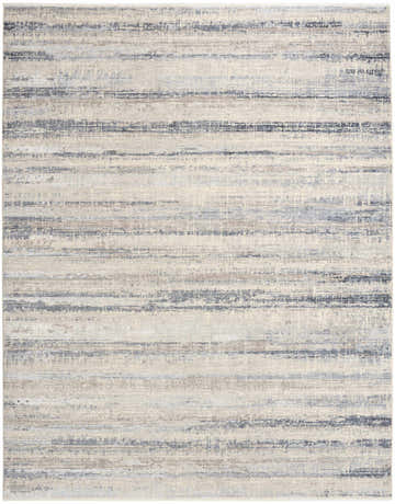 Close-up of the Calvin Klein CK089 Drift Blue Rug. Light blue, gray, and beige horizontal stripes create a modern, textured design.