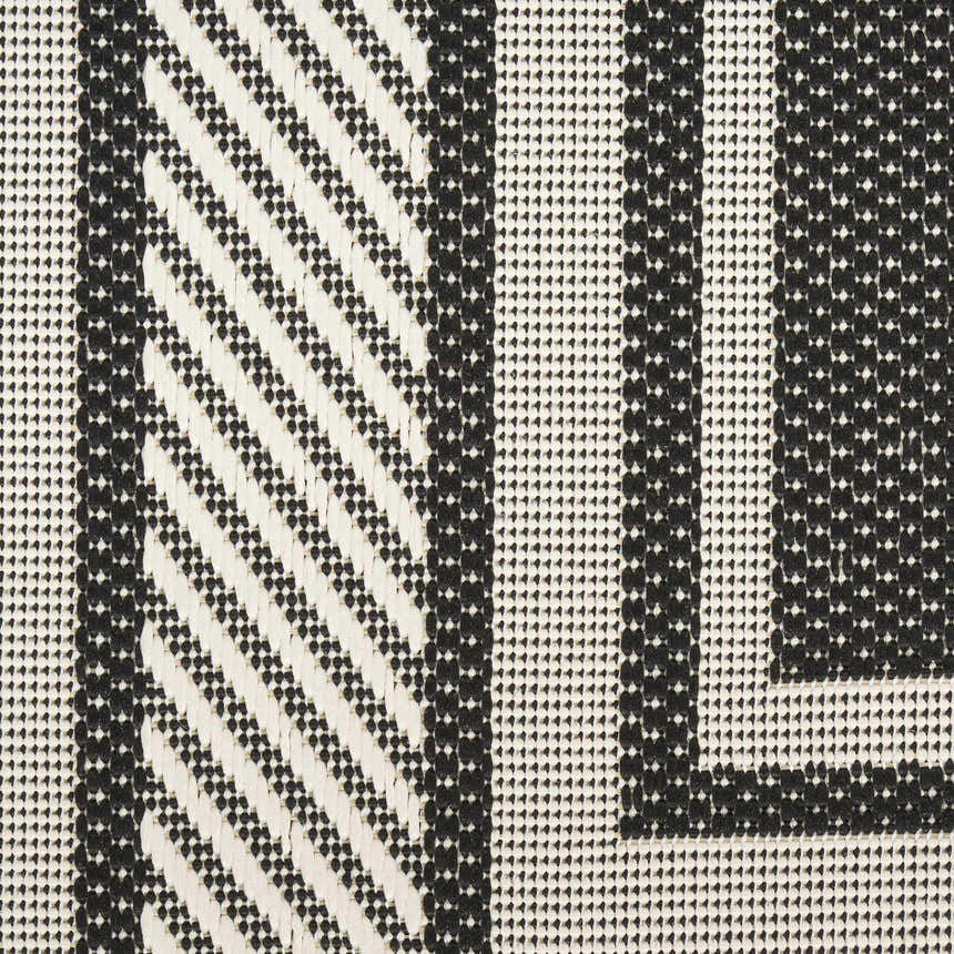 Close-up of Nourison Horizon Black rug showing geometric patterns and textures. Modern indoor/outdoor rug.